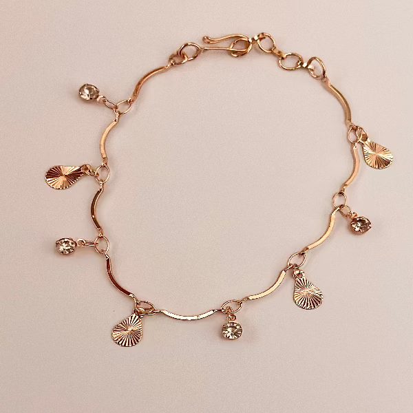 Gold-Plated Charm Bracelet with Diamond Accents and Textured Disc Charms – Elegant and Playful Jewelry