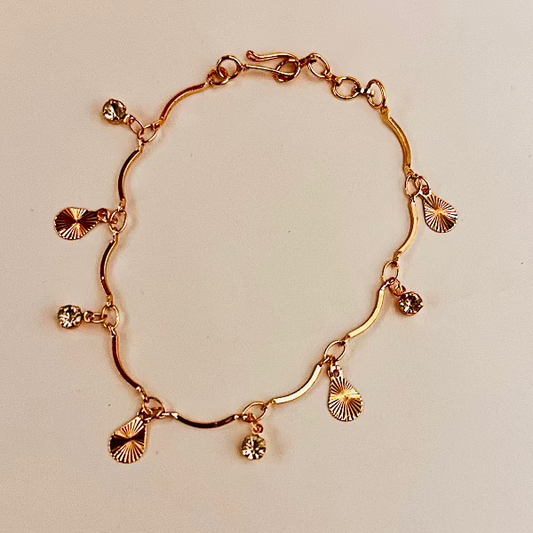 Gold-Plated Charm Bracelet with Diamond Accents and Textured Disc Charms – Elegant and Playful Jewelry